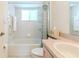 Clean bathroom featuring tile floors, a tub, a shower, and a functional vanity at 11158 Heathrow Ave, Spring Hill, FL 34609