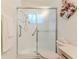 Clean bathroom featuring a shower with sliding glass doors and safety bars at 11158 Heathrow Ave, Spring Hill, FL 34609