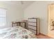 Bright bedroom featuring a ceiling fan, plush carpet, and desk with mirror at 11158 Heathrow Ave, Spring Hill, FL 34609