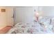 Bedroom with double door closet, plush carpet, and comfortable floral-patterned bed at 11158 Heathrow Ave, Spring Hill, FL 34609