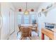 Bright eat-in kitchen with a bay window and white appliances at 11158 Heathrow Ave, Spring Hill, FL 34609