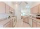Functional kitchen layout with ample counter space and neutral cabinets at 11158 Heathrow Ave, Spring Hill, FL 34609