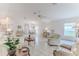 Expansive living area featuring tile floors, an open layout, and abundant natural light from the windows at 11158 Heathrow Ave, Spring Hill, FL 34609