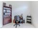 Functional office space with dark wood furnishings and tile flooring, perfect for a work-from-home setup at 11158 Heathrow Ave, Spring Hill, FL 34609