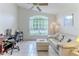 Bright home office featuring large window, desk, comfortable seating and tile flooring at 11158 Heathrow Ave, Spring Hill, FL 34609