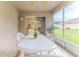 Relaxing screened-in patio with a ceiling fan and a view of the backyard at 11158 Heathrow Ave, Spring Hill, FL 34609