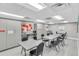Bright activity room with tables, chairs, and storage for crafts and hobbies at 11308 Mollymawk Ct, New Port Richey, FL 34654