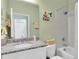 Bathroom with granite countertops, shower and tub at 11308 Mollymawk Ct, New Port Richey, FL 34654