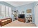Cozy bedroom with ample storage and natural light from shuttered windows at 11308 Mollymawk Ct, New Port Richey, FL 34654
