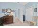 Bedroom featuring dresser, chair, and closet at 11308 Mollymawk Ct, New Port Richey, FL 34654