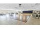 Spacious community center with tables, chairs, and a stage for events at 11308 Mollymawk Ct, New Port Richey, FL 34654