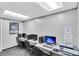 Well-lit computer room with multiple workstations and a printer for resident use at 11308 Mollymawk Ct, New Port Richey, FL 34654