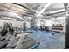 Bright fitness center with modern equipment, weights, and mounted televisions at 11308 Mollymawk Ct, New Port Richey, FL 34654