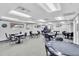 Community game room with multiple tables for cards and board games at 11308 Mollymawk Ct, New Port Richey, FL 34654