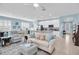 Open-concept living space with combined living room, dining area, and kitchen at 11308 Mollymawk Ct, New Port Richey, FL 34654