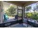 Relax on the screened porch with lush backyard views at 11308 Mollymawk Ct, New Port Richey, FL 34654