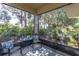 Cozy screened porch providing tranquil backyard views at 11308 Mollymawk Ct, New Port Richey, FL 34654