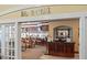 Inviting view into the Bar & Grill, showcasing a well-stocked bar and comfortable seating at 11389 Mcnally Dr, Spring Hill, FL 34609