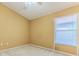 Bedroom features natural light and a ceiling fan at 11389 Mcnally Dr, Spring Hill, FL 34609