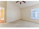 Neutral bedroom featuring a ceiling fan, window, carpet, and painted in a neutral color at 11389 Mcnally Dr, Spring Hill, FL 34609