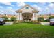 Beautiful clubhouse with manicured lawns and inviting entrance at 11389 Mcnally Dr, Spring Hill, FL 34609