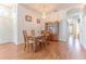 Elegant dining area with wood floors, chandelier, and classic wooden china cabinet at 11389 Mcnally Dr, Spring Hill, FL 34609
