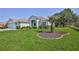 Well-kept home featuring a manicured lawn and inviting curb appeal with mature landscaping at 11389 Mcnally Dr, Spring Hill, FL 34609