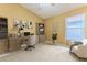Bright home office featuring a desk, cabinets, and a comfortable chair at 11389 Mcnally Dr, Spring Hill, FL 34609
