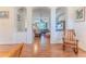 Spacious living area with hardwood floors, decorative arches, and a comfortable seating arrangement at 11389 Mcnally Dr, Spring Hill, FL 34609