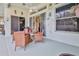 Covered patio with dining set and decorations, perfect for enjoying outdoor meals and relaxation at 11389 Mcnally Dr, Spring Hill, FL 34609