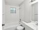 Standard full bathroom features a shower-tub combo with white tile at 11751 Key Lime Dr, New Port Richey, FL 34654