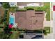 Aerial view of a home showcasing its backyard pool and well-maintained landscaping at 12750 Tikal Way, Trinity, FL 34655
