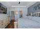Bright bedroom suite with neutral decor featuring an ensuite bathroom at 12750 Tikal Way, Trinity, FL 34655