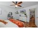 Bedroom with hardwood floors, a desk, and a view through to another living space at 12750 Tikal Way, Trinity, FL 34655
