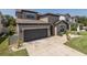 Charming two-story home featuring a two-car garage, landscaped yard, and neutral color palette at 12750 Tikal Way, Trinity, FL 34655