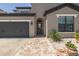 Attractive home featuring a brick pathway, a two-car garage, and a covered front entrance at 12750 Tikal Way, Trinity, FL 34655