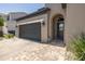 Attractive home featuring a brick pathway, a two-car garage, and a covered front entrance at 12750 Tikal Way, Trinity, FL 34655