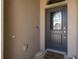Elegant front door with decorative glass and a welcoming 'welcome' mat at 12750 Tikal Way, Trinity, FL 34655