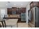 Gourmet kitchen featuring stainless steel appliances, granite countertops, and ample cabinet space at 12750 Tikal Way, Trinity, FL 34655