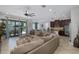 Bright, open-concept living room flowing into the kitchen and dining area at 12750 Tikal Way, Trinity, FL 34655