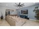 Spacious living room featuring neutral tones, ample natural light, and stylish decor at 12750 Tikal Way, Trinity, FL 34655