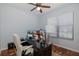 Functional office space with a modern desk, ergonomic chair, and ample natural light at 12750 Tikal Way, Trinity, FL 34655
