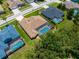 Aerial view of a neighborhood with screened-in pools and well-maintained landscaping at 13155 Cori Loop, Spring Hill, FL 34609