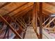 Spacious attic with exposed beams and insulation, great for future expansion at 13155 Cori Loop, Spring Hill, FL 34609