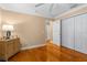 Cozy bedroom with hardwood floors, neutral paint, and ample closet space at 13155 Cori Loop, Spring Hill, FL 34609