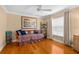Cozy bedroom with a daybed, hardwood floors, and natural light, offering a relaxing atmosphere at 13155 Cori Loop, Spring Hill, FL 34609