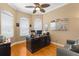 Bright home office with custom built-in desk, wood floors and display case at 13155 Cori Loop, Spring Hill, FL 34609