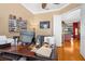 View of the home office featuring custom desk, hardwood floors and neutral paint at 13155 Cori Loop, Spring Hill, FL 34609