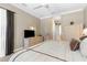 Comfortable main bedroom features neutral tones, plush carpeting, and ample closet space at 13155 Cori Loop, Spring Hill, FL 34609