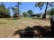 Large backyard with trees and new fence line, offering privacy and ample space at 13180 Lawrence St, Spring Hill, FL 34609